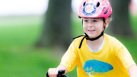 A PMC Kids Ride participant riding her bike