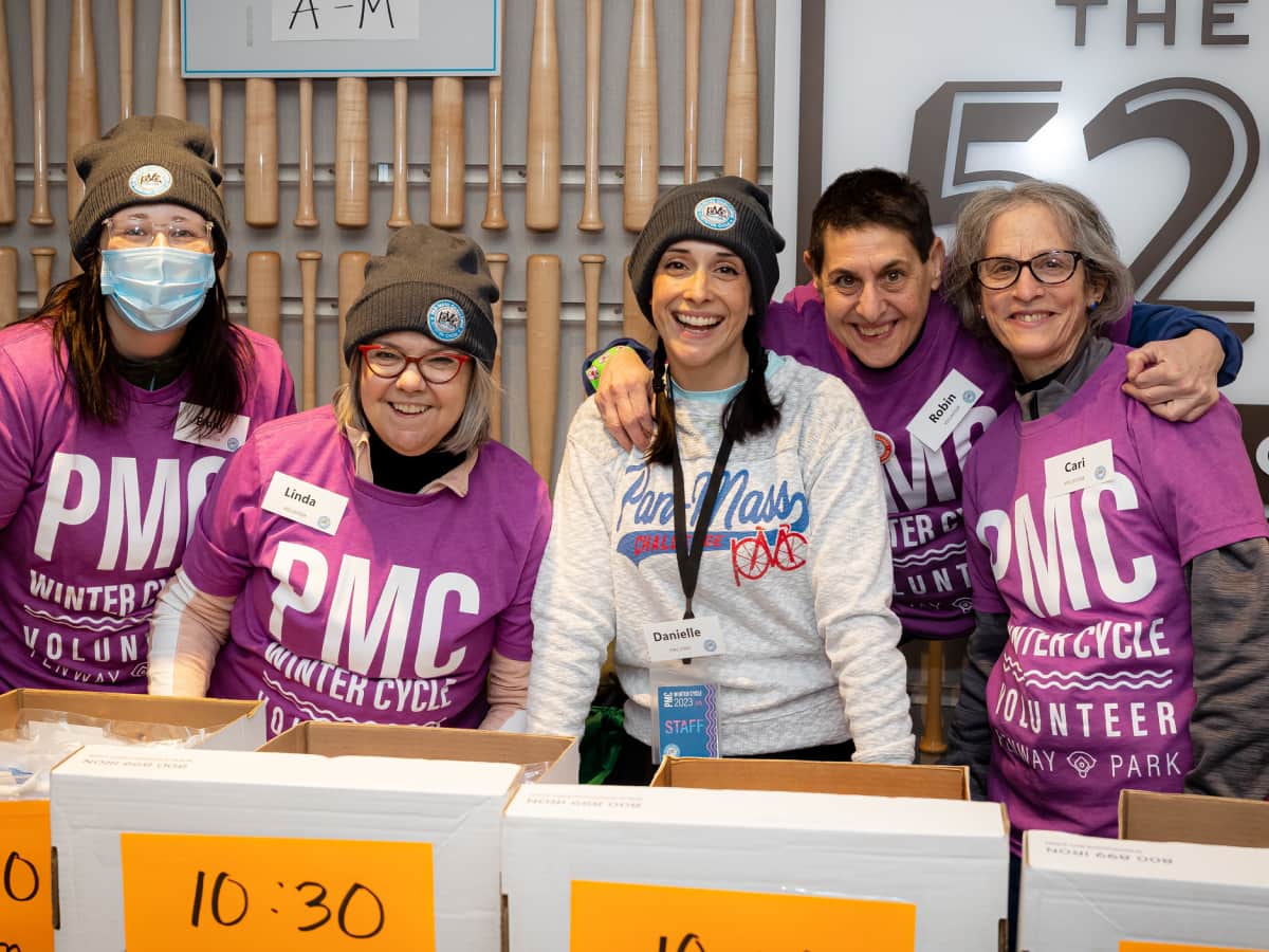 PMC Winter Cycle volunteers at rider check-in at Fenway Park